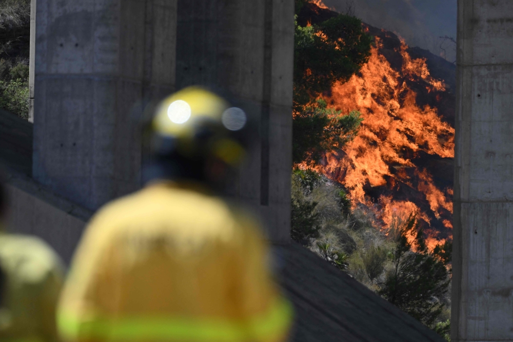 ‘Ring the bells’: Residents recall escape from deadly Spanish wildfire