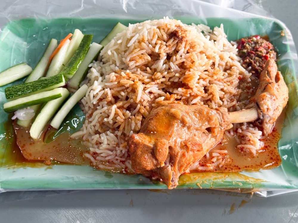 Nasi Minyak with its long grains sauteed in ghee and paired with 'gulai ayam' is breakfast fare in Terengganu -  Picture by Lee Khang Yi