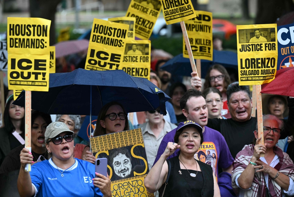 Demonstrators hold signs during the ‘Justice for Lorenzo’ protest against US Immigration and Customs Enforcement (ICE) following the killing of Mexican migrant Lorenzo Salgado Araujo at City Hall in downtown Houston, Texas, on July 11, 2026. Lorenzo Salgado Araujo, 52, was killed by an ICE officer in Houston early on July 7, marking the first fatal shooting involving US immigration officers since two January 2026 killings in the northern city of Minneapolis that drew national headlines. — AFP pic 