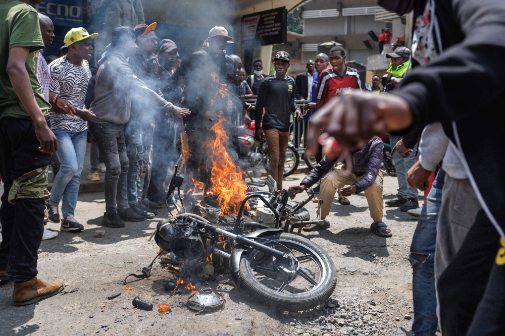 Protestors torch a motor bike belonging to suspected hired goons they claimed were paid to inflitrate anti-government demonstrators and cause vandalism among other crimes in a bid too discredit the ongoing protests to demand accountability from President Willam Ruto’s government in Nairobi on July 23, 2024. — AFP pic 