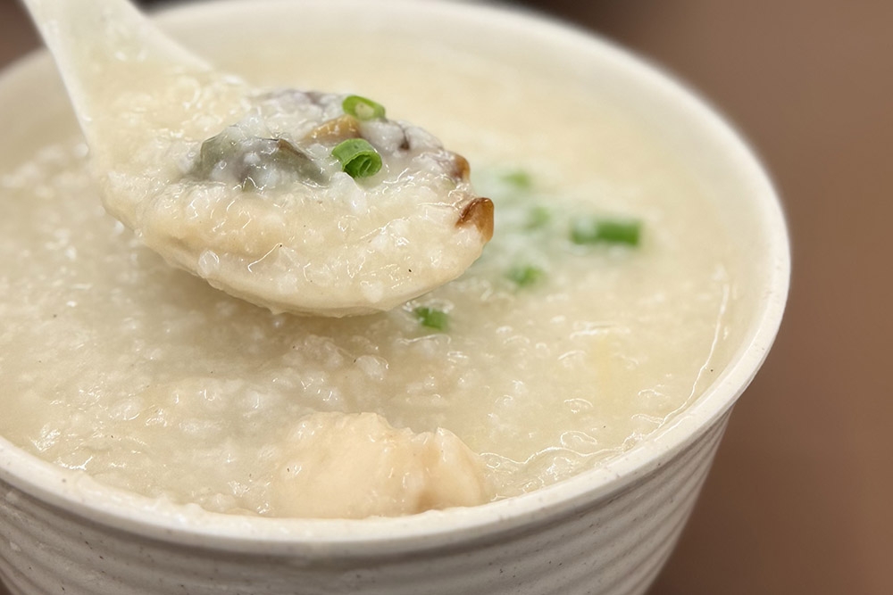 Century egg and dory fish porridge. — Picture by CK Lim