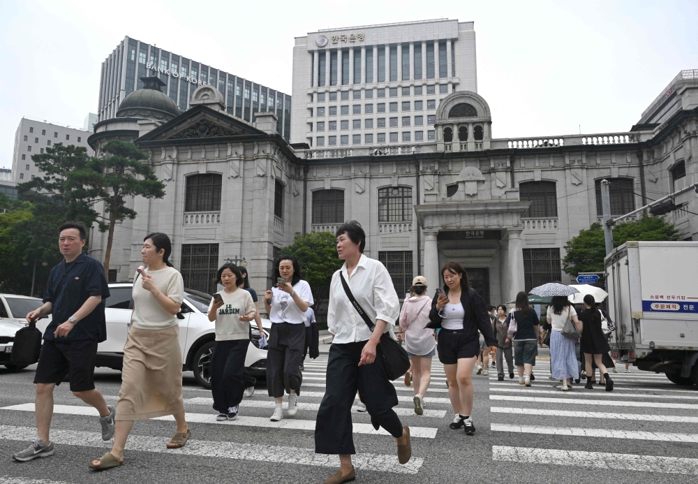 South Korea central bank raises rates for first time in three years as chip exports surge