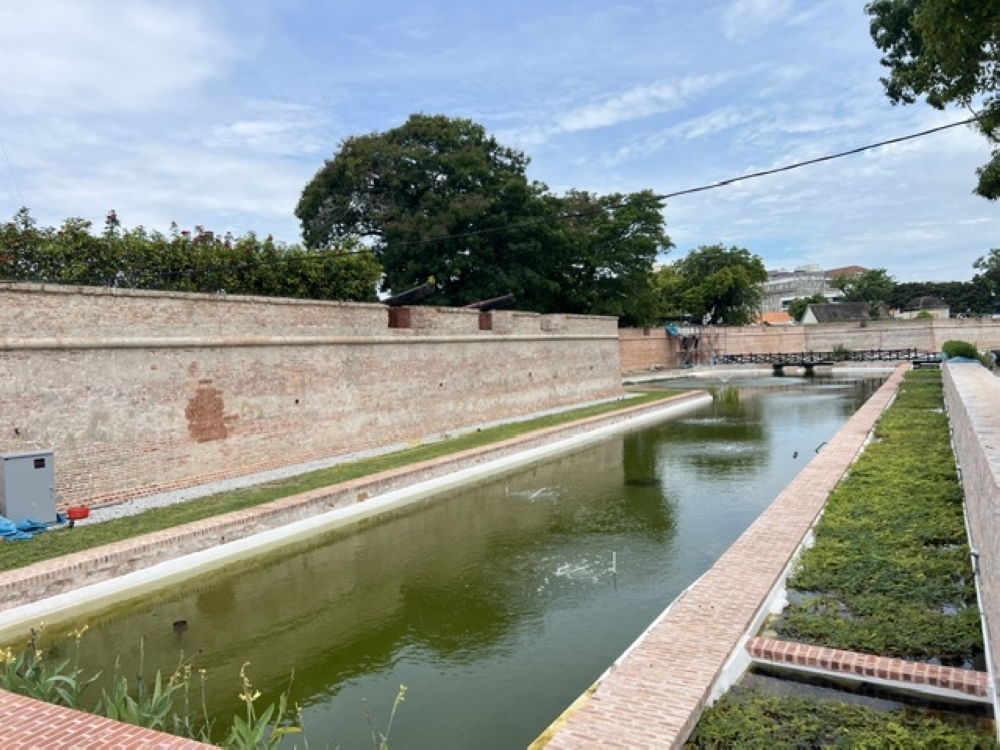 Water once again fills the restored moat at Fort Cornwallis after conservation works revived a feature that had been filled in more than a century ago. — Picture by Opalyn Mok