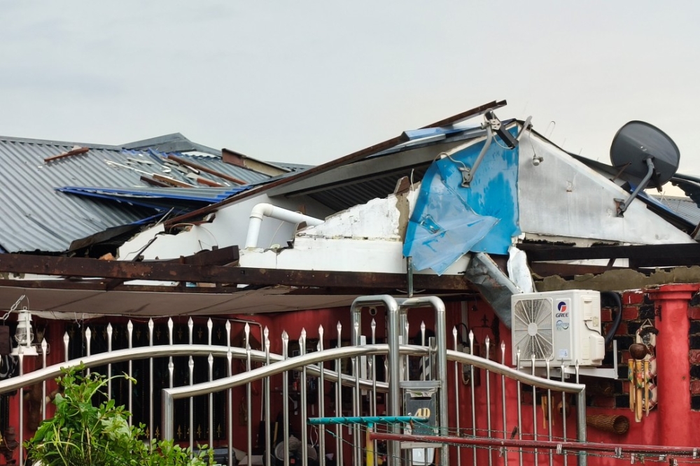 Damages to the roof of a house in Sibu Jaya after strong winds on Saturday. — The Borneo Post pic