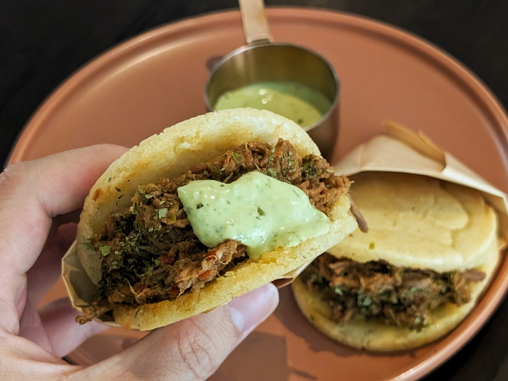 The ‘arepas’ come with ‘guasacaca’, a Venezuelan avocado-based sauce that is a sharper, lighter version of ‘guacamole’. — Picture by Ethan Lau