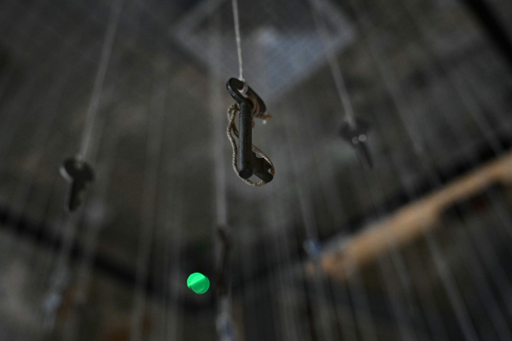 Keys of destroyed homes hang from the ceiling as part of an installation titled ‘Keys Without Homes’ by artist Adeeb Farhat at the ‘Hkeeli ya Jnoub’ (‘Tell Me, O South’) exhibition in Beirut on July 17, 2026 to honour memory of the homes lost in southern Lebanon during the conflict. — AFP pic