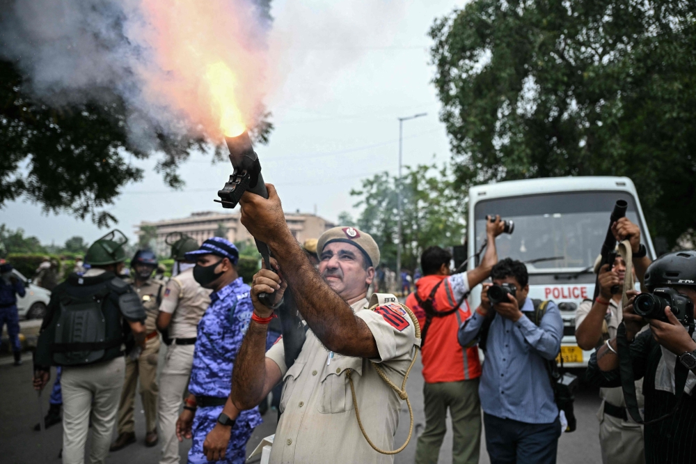 Indian police fire tear gas, baton-charge protesters as thousands demand action over exam leaks