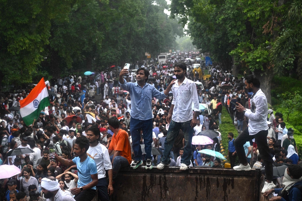 Cockroach Janta Party activists gather in New Delhi on July 20, 2026, to demand Education Minister Dharmendra Pradhan’s resignation over alleged examination irregularities. — AFP pic