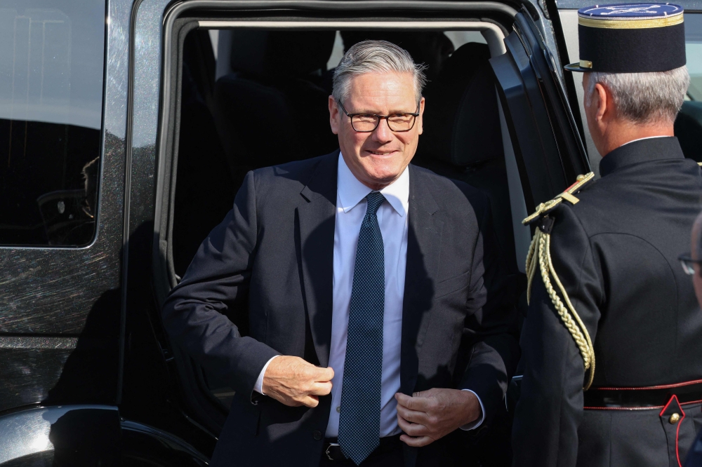 British Prime Minister Keir Starmer arrives for the annual Bastille Day military parade on the Champs-Élysées in Paris on July 14, 2026.