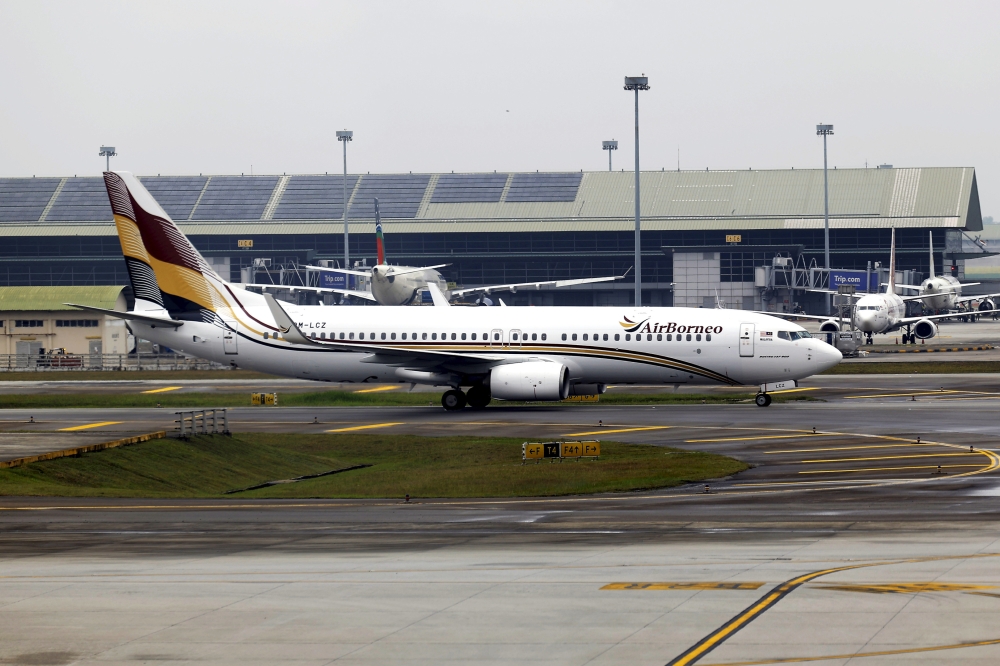 An AirBorneo Boeing 737-800 aircraft lands at KLIA Terminal 1 in Sepang today. — Bernama pic