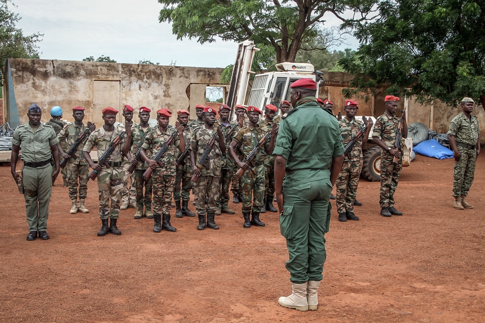 Members of the Central African Armed Forces stand in formation during Prime Minister Felix Moloua's visit to Birao on July 18. — AFP pic