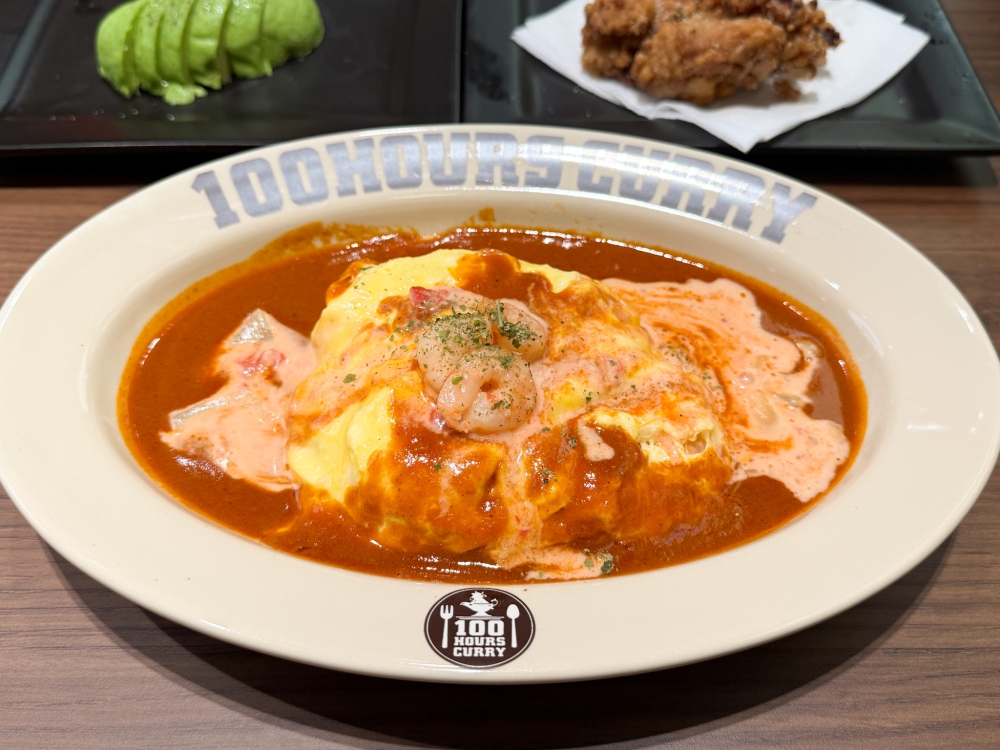 Creamy Tomato Shrimp with Omelette Curry Rice paired with the milder butter curry, which offers a creamier taste. — Picture by Lee Khang Yi
