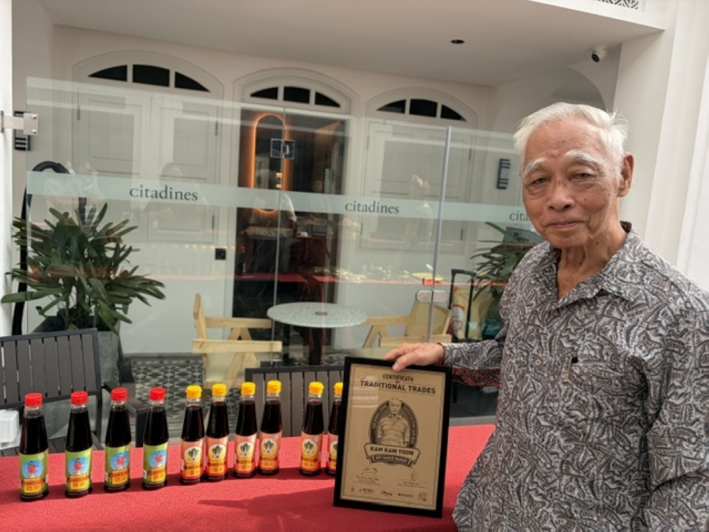 Kam Kam Yoon took over the San Kwan Loong soy sauce factory business at 19 years old. — Picture by Opalyn Mok.