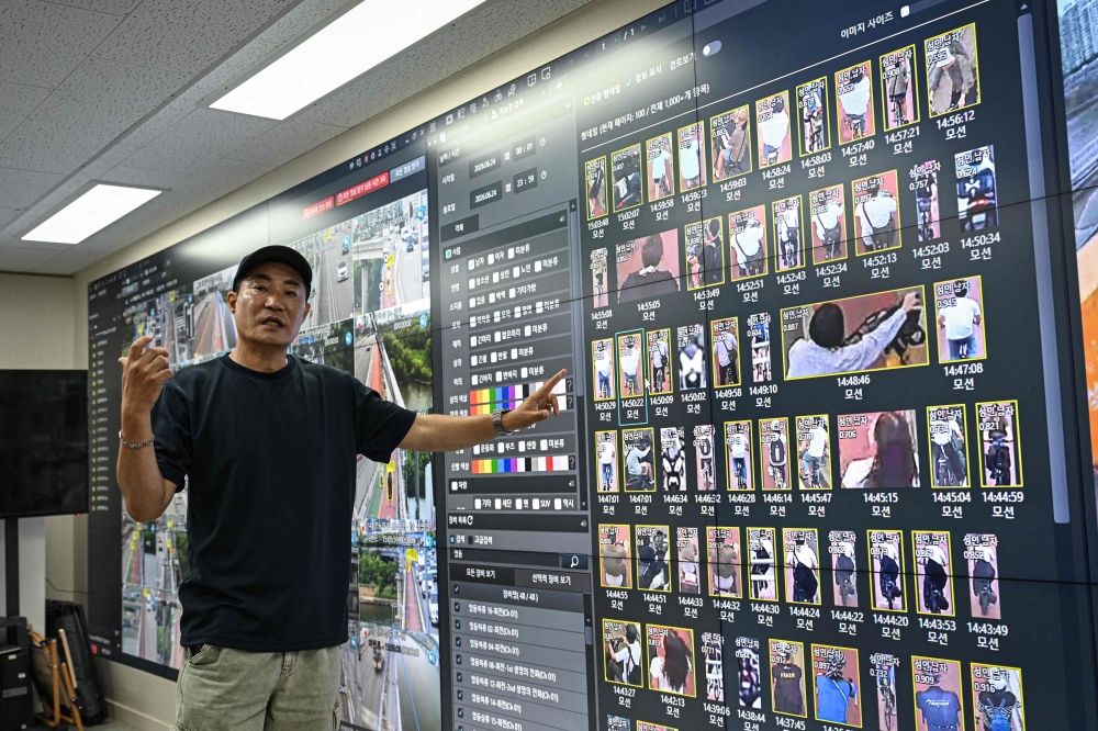 This photo taken on June 24, 2026 shows Kim Jun-young, chief of Hangang Bridge CCTV Integrated Control Centre, introducing the AI surveillance cameras during an interview with AFP in the control room in Seoul. The artificial intelligence-driven surveillance system alerts first responders if someone lingers in certain locations, enters an area deemed unsafe, or picks up one of the bridges’ dedicated suicide-prevention phones. — AFP pic