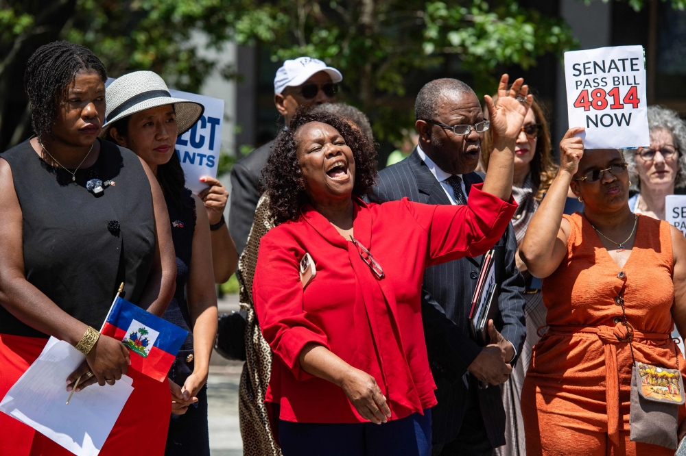 Local Haitian leaders attend a rally calling on Congress to restore Temporary Protected Status (TPS) for Haitians, in Boston, Massachusetts July 23, 2026. — AFP pic