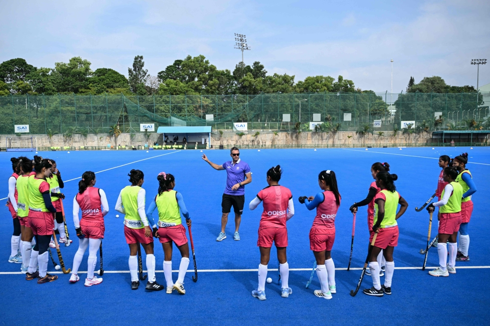 The Indian women’s national hockey team interact with analytical coach Matias Vila (centre) during a practice session at the Sports Authority of India (SAI) centre in Bengaluru July 16, 2026. — AFP pic