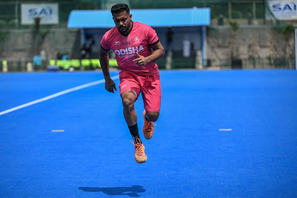 Harmanpreet Singh, captain of the Indian men’s national hockey team, warms up with his teammates before a practice session at the Sports Authority of India (SAI) centre in Bengaluru July 16, 2026. — AFP pic