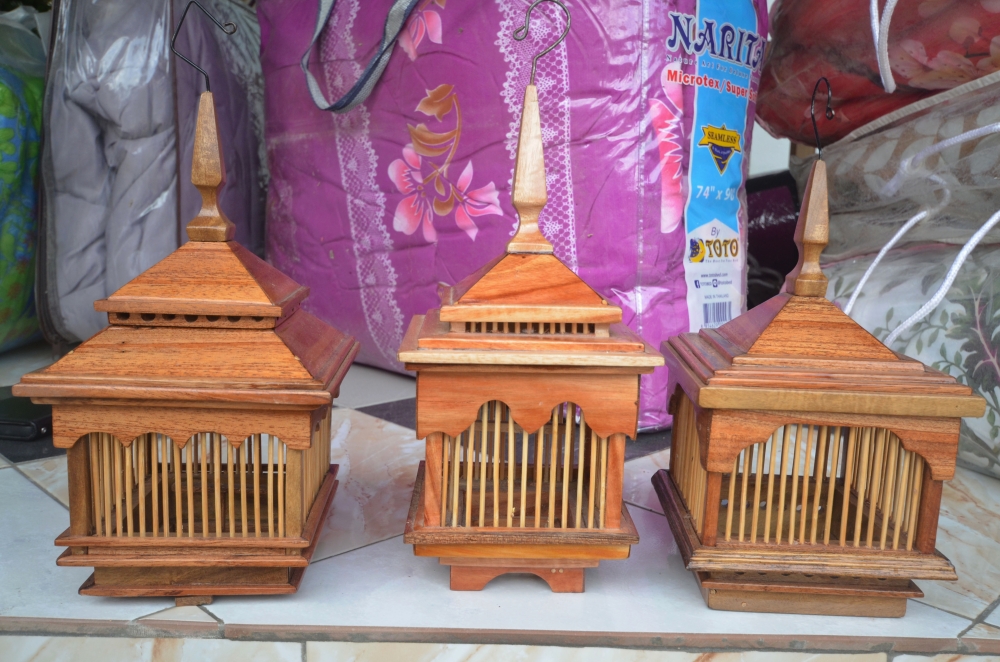 Custom-made wooden and sago palm cages have become increasingly sought after as bush cricket sound competitions attract enthusiasts across Besut. — Bernama pic