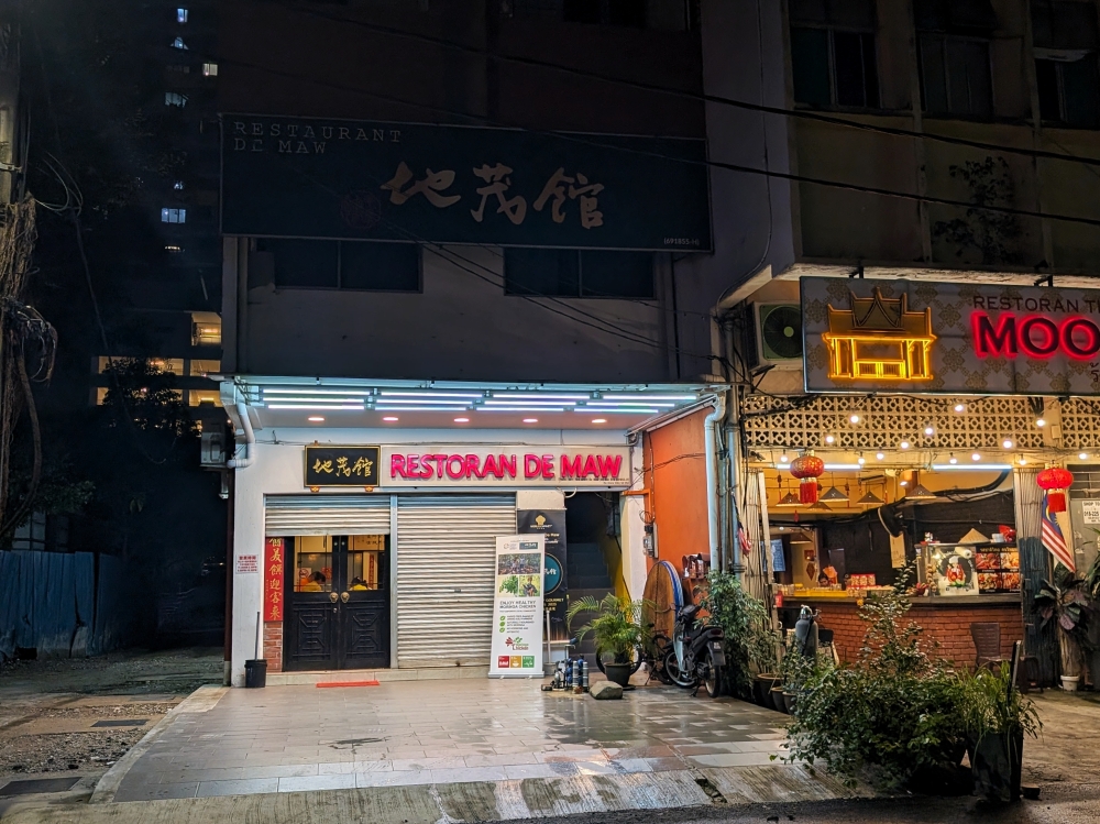 The restaurant is located next to an open-air parking lot next to Menara PGRM. — Picture by Ethan Lau