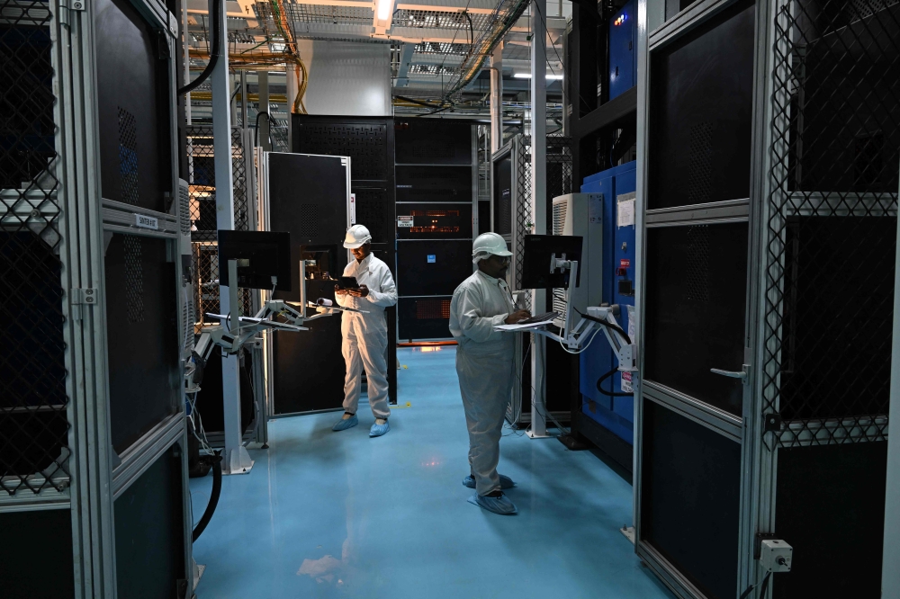 Employees monitor data on screens at Sterlite Technologies Limited (STL) manufacturing facility in Maharashtra’s Chhatrapati Sambhaji Nagar July 9, 2026. — AFP pic