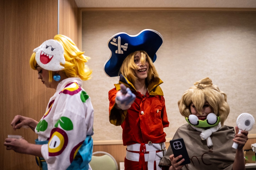 Cosplayers gather in a hotel before taking part in the Osu Cosplay Parade, during the second day of the World Cosplay Summit 2026 in Nagoya on August 1, 2026. — AFP pic