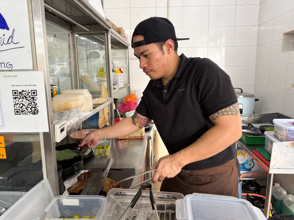Originally from Miri, Adrian Langat used to be in the oil and gas industry but switched to selling Western food there... he relocated here to open this grill place honouring his Dayak-Kelabit heritage. — Picture by Lee Khang Yi