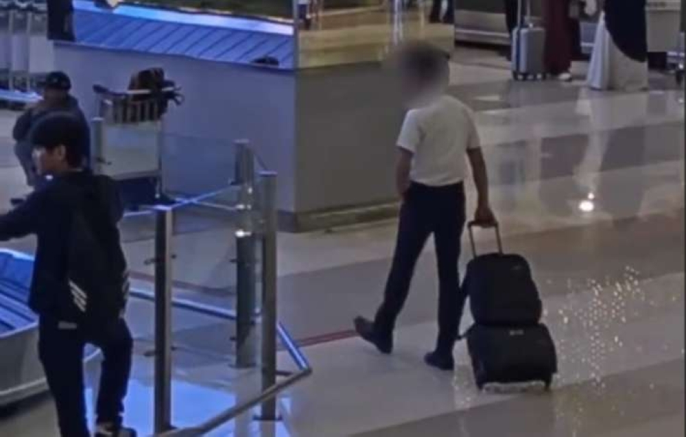 Indonesian authorities put out airport video of Malaysian pilot allegedly smuggling 25kg ecstasy