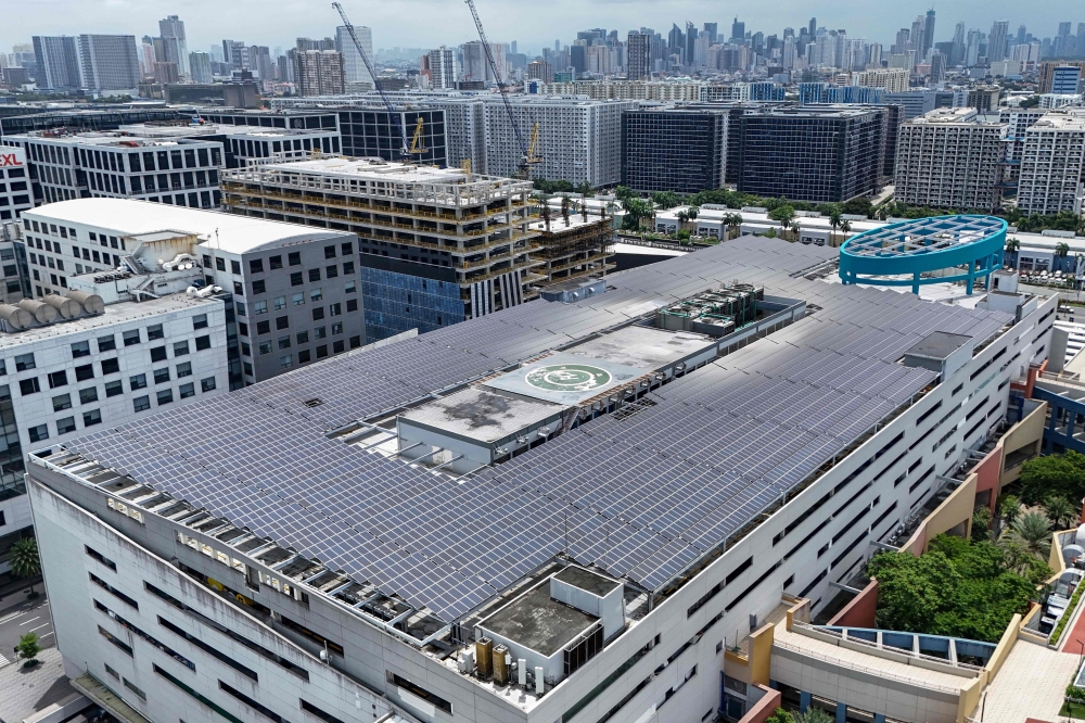 An aerial photo shows solar panels on the roof of SM Mall of Asia in Pasay, Metro Manila on July 13, 2026. — AFP pic