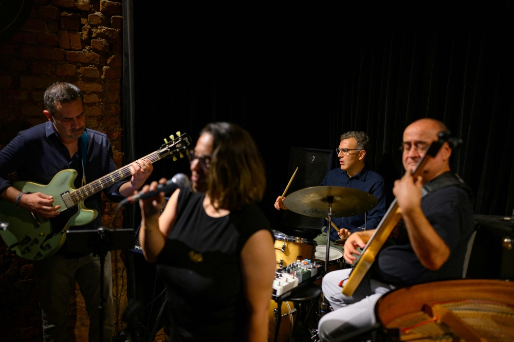 Derin Bayhan (2ndR), the drummer of the jazz band ‘Emre Tankal Trio feat Duygu Argin’, perform at Nardis jazz club in Istanbul on July 22, 2026. — AFP pic