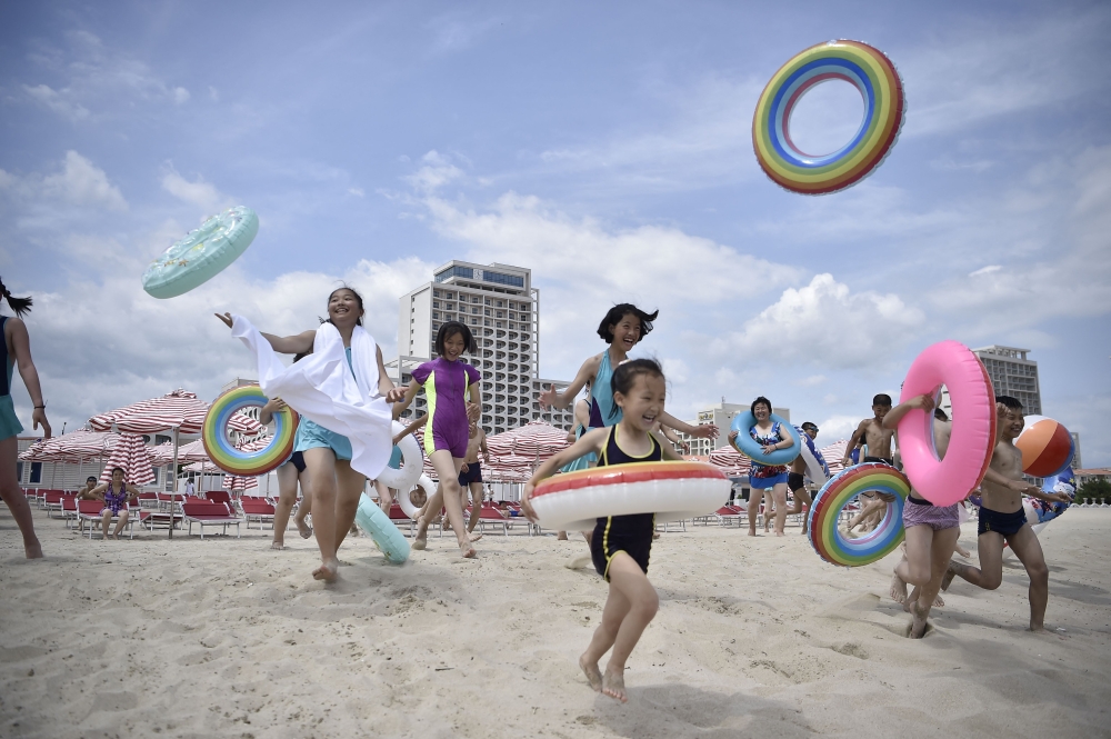 Domestic tourists visit the beach at Wonsan Kalma Coastal Tourist Area in Wonsan, North Korea’s Kangwon Province on July 1, 2025. — AFP pic
