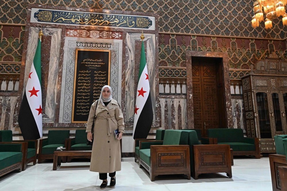 Novelist and Syria lawmaker Nour Jandali poses inside parliament in Damascus on July 27, 2026, as women make up around 10 per cent of seats in the country’s first post-Assad assembly. — AFP pic