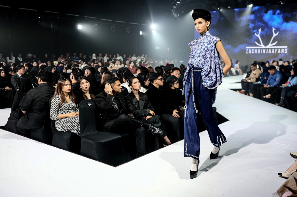 A model walks down the runway in a Zachrin Jaafars’ batik-inspired look. — Bernama pic