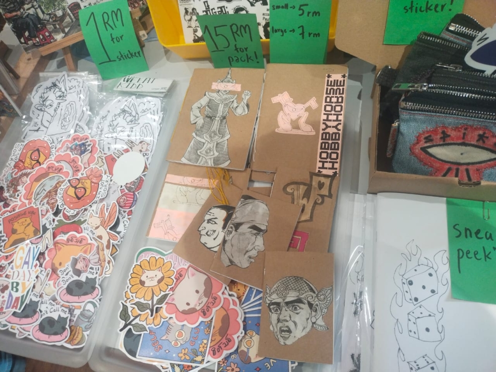 Jae Jae represented Myanmar-based Thanbuya Ne Thanpayo, which showcased stickers, handmade pouches and other works at KL Zine Etc 2026. — Picture by Ian Jeremiah