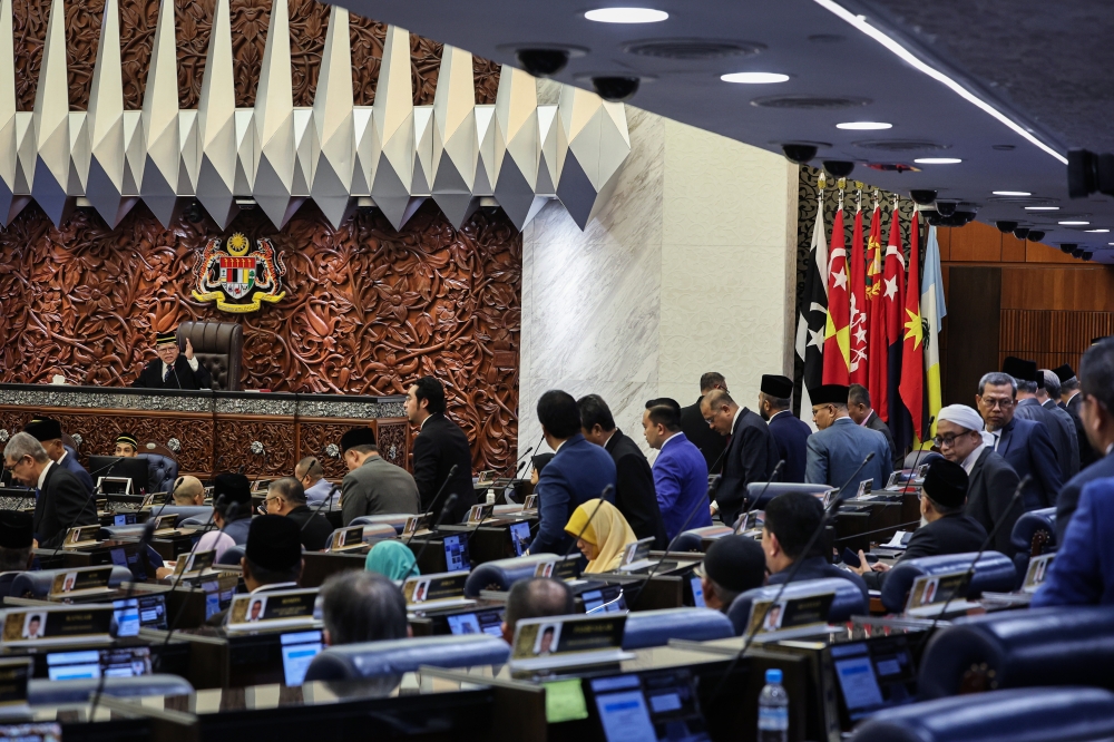 Some Opposition lawmakers (standing) staged a walkout from the Dewan Rakyat special sitting on the Royal Commission of Inquiry Report on Lembaga Tabung Haji at Parliament on August 11, 2026. — Bernama pic