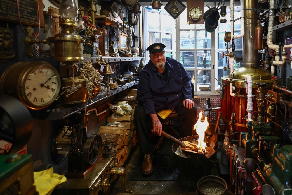 Peter McLaughlin inside Shantry Shed in London recreated boiler room shortlisted in Britain Shed of the Year competition. — AFP pic