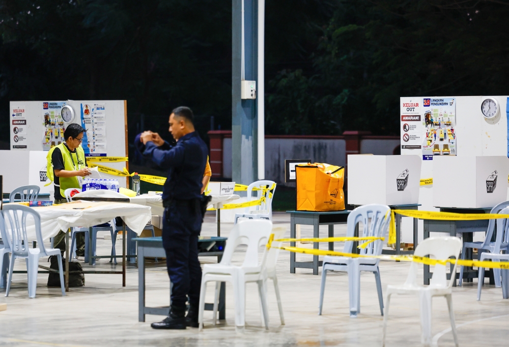Election Commission personnel make final preparations before polling centre opens for the Negeri Sembilan state election at a school in Rantau, August 1, 2026. — Bernama pic
