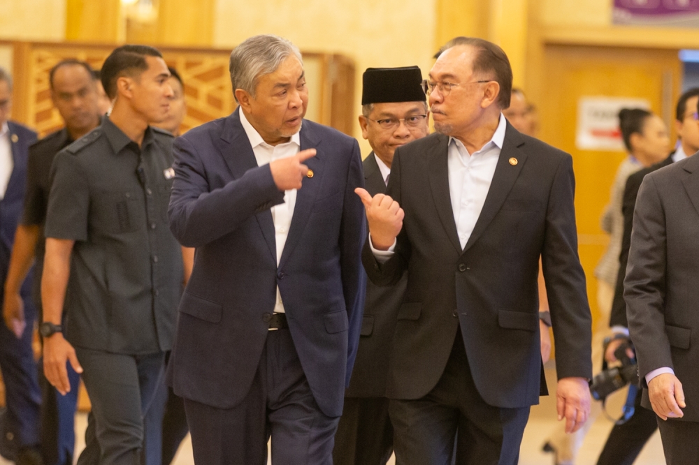 Prime Minister Datuk Seri Anwar Ibrahim (right) and Deputy Prime Minister Datuk Seri Ahmad Zahid Hamidi (left) share a light-hearted moment even as their Pakatan -BN partnership enters a more challenging phase. — Picture by Raymond Manuel
