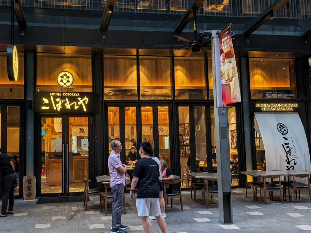 Tsukishima Monja Koboreya is located in the restaurant street on the ground floor of LaLaport BBCC.— Picture by Ethan Lau