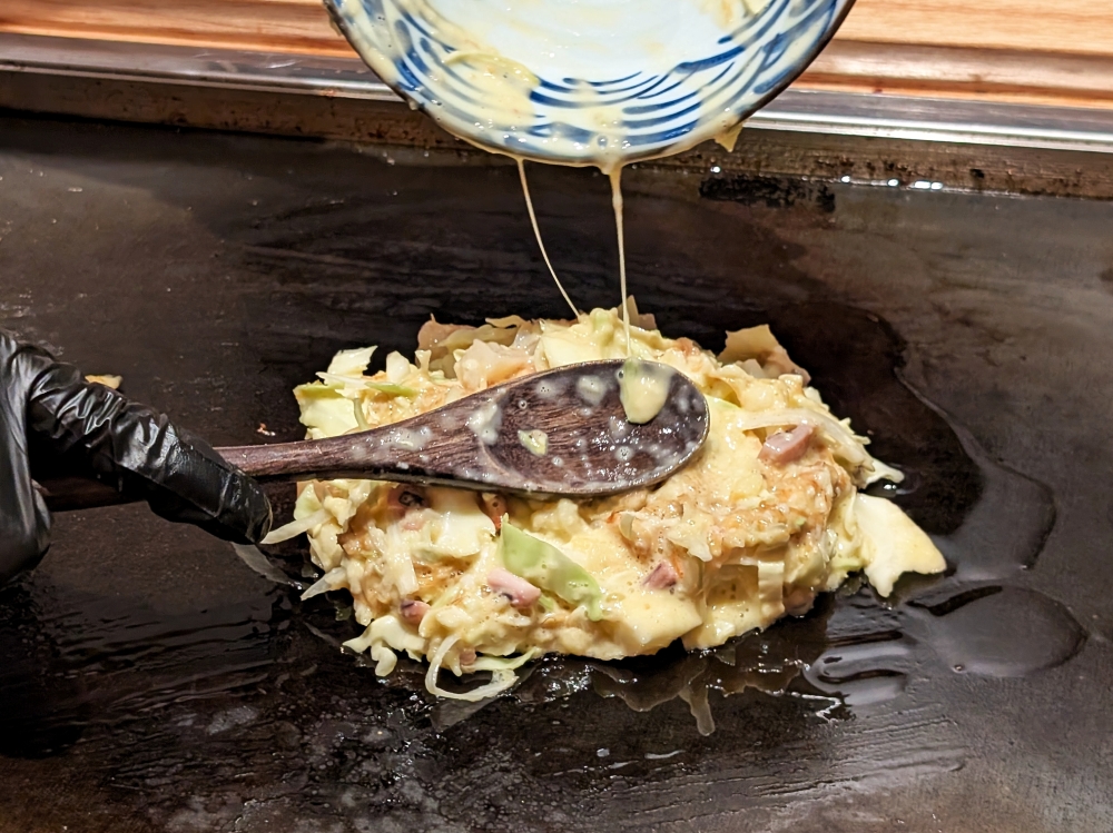 Like most ‘monjayaki’ speciality restaurants in Tokyo, Koboreya also offers ‘okonomiyaki’.— Picture by Ethan Lau