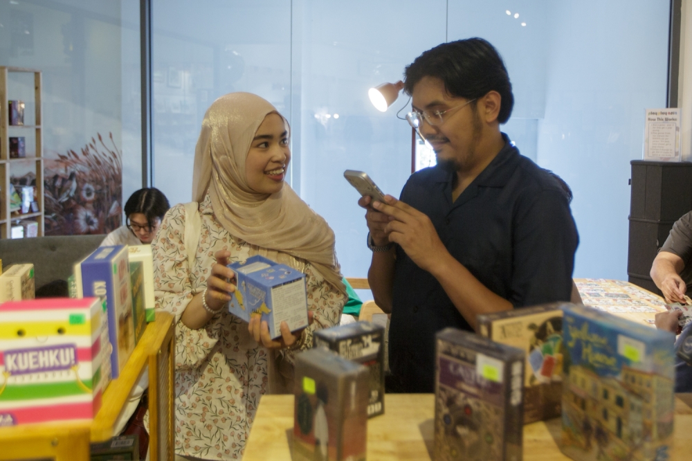 Two visitors take a stroll through the newly opened Play Play Asia store at GMBB. — Picture by Raymond Manuel