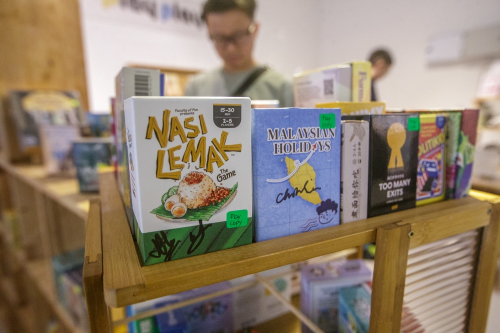 Malaysian-made games showcased at the Play Play Asia store from Nasi Lemak The Game and Malaysian Holidays. — Picture by Raymond Manuel
