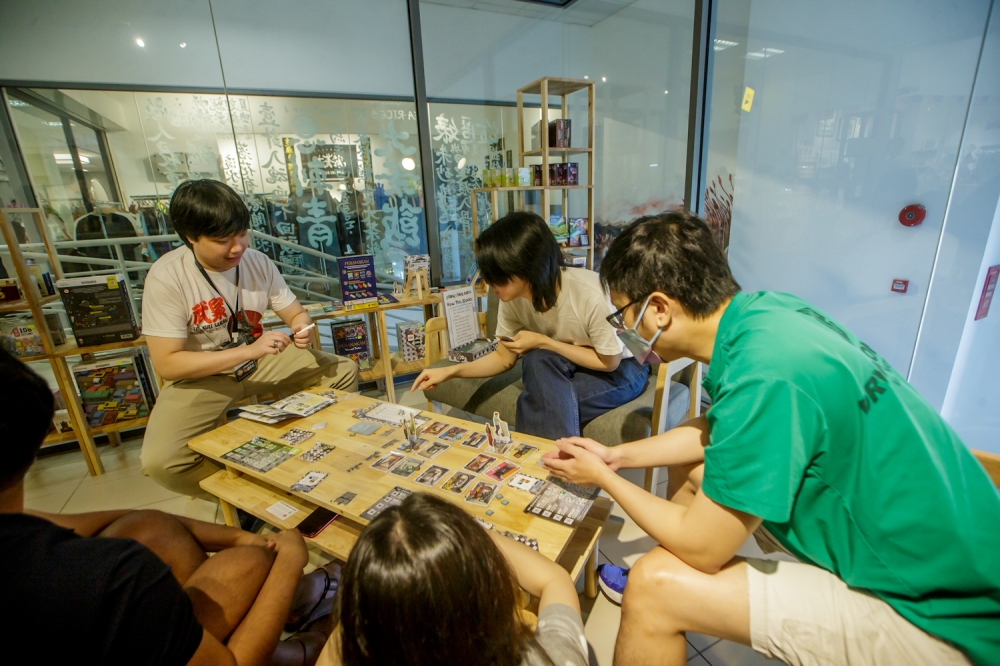 Visitors enjoy trying out games at the Play Play Asia store. — Picture by Raymond Manuel