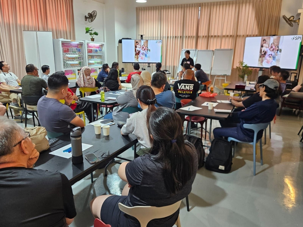 Lim Jian Bin (standing), also known as Takeshi Lim, holds a class for his Singapore-based vending machine business on January 5, 2025 before the venture collapsed a year later. — Picture from Facebook/Nozomii Vending