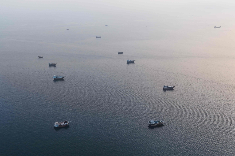 Boats anchored off Oman’s northern Musandam Peninsula near the Strait of Hormuz, June 27, 2026. — AFP pic