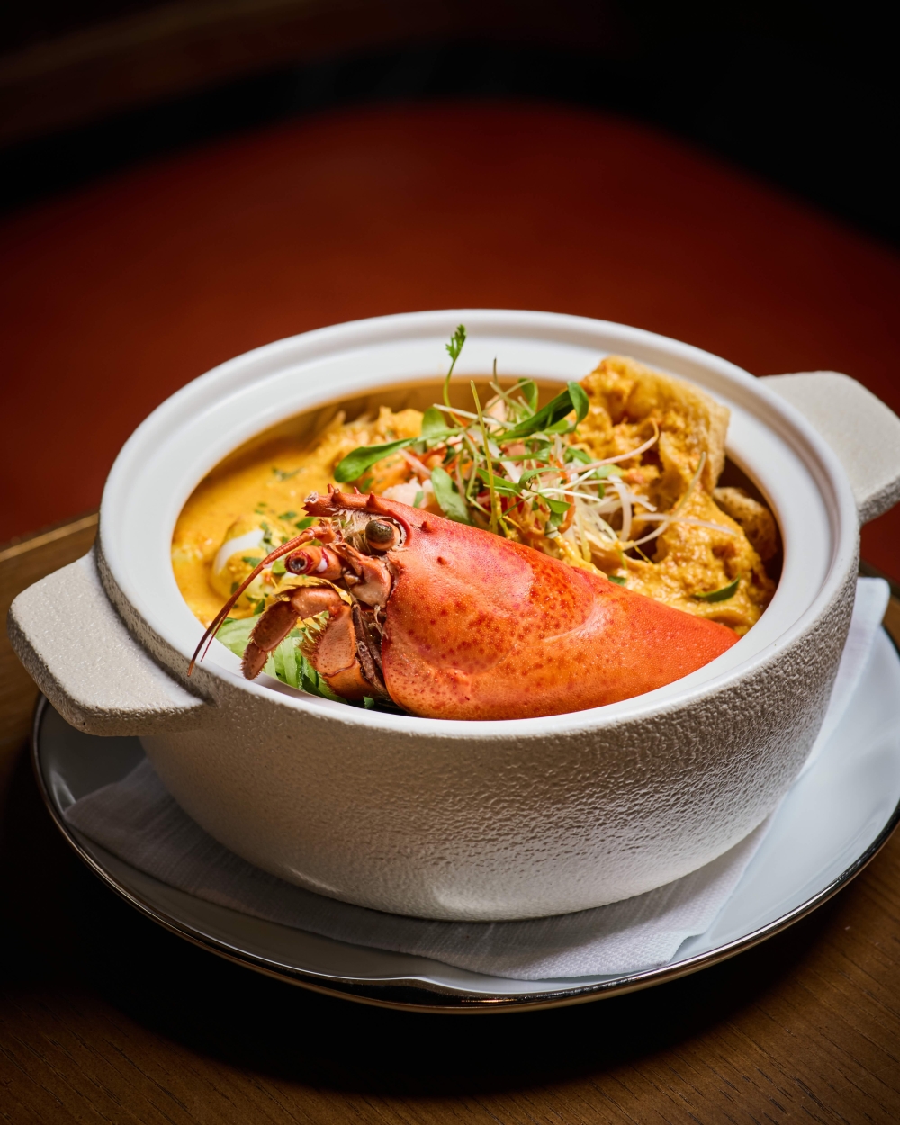 Nyonya Laksa is served with rock lobster and vermicelli in a coconut curry broth, with quail egg, ‘laksa’ leaves and calamansi. — Picture courtesy of Park Hyatt Kuala Lumpur
