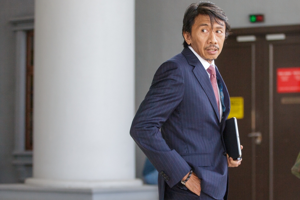 Defense lawyer Datuk Amer Hamzah Arshad leaves the Kuala Lumpur Court Complex August 7, 2026. — Picture by Raymond Manuel