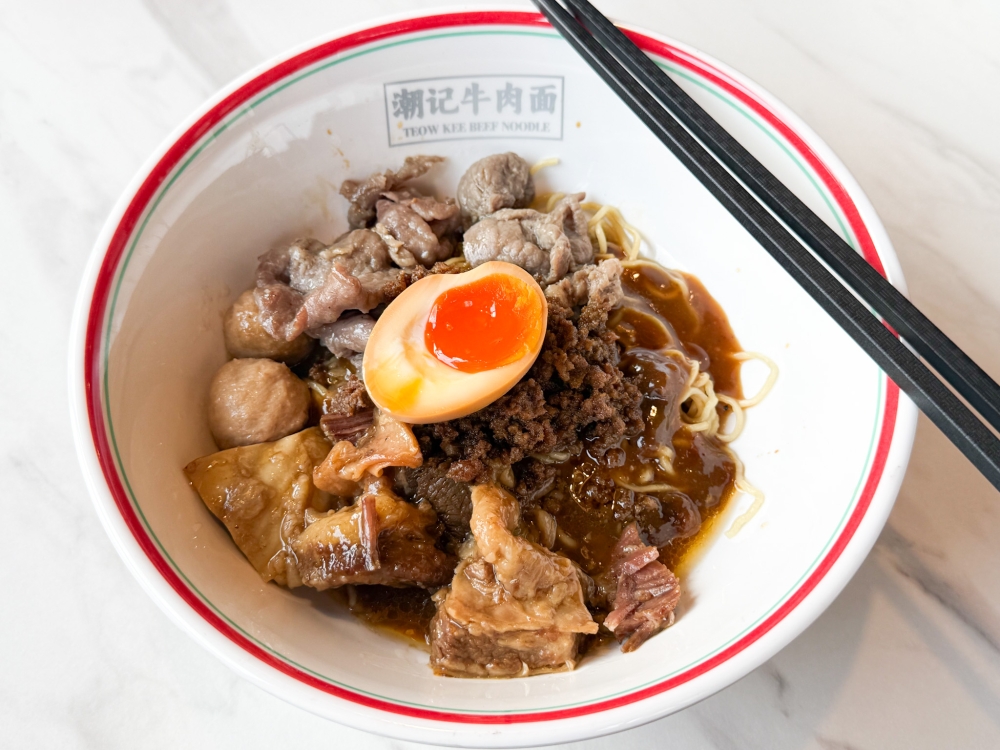 The dry beef noodles have the strands coated in a thick, brown sauce. — Picture by Lee Khang Yi