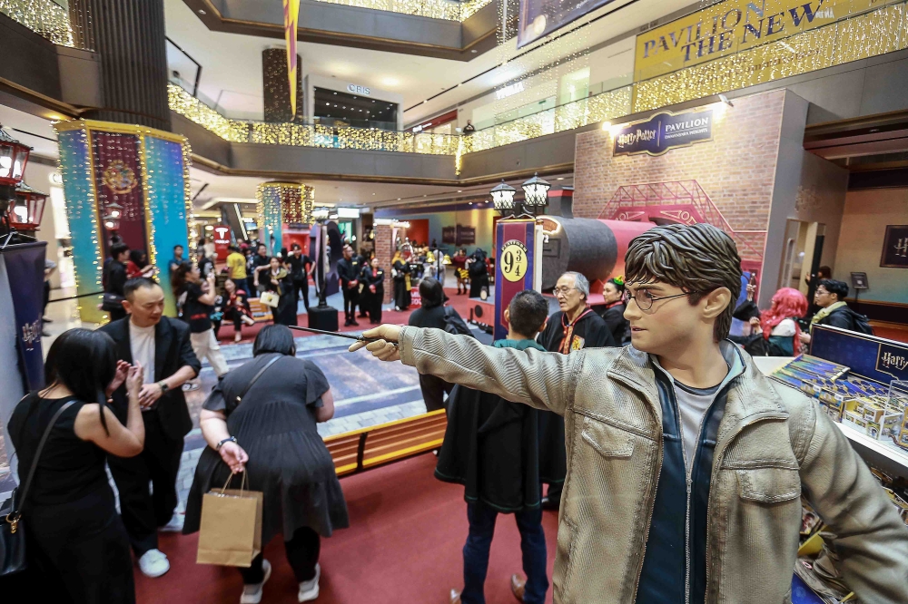 A statue of Harry Potter, as portrayed by Daniel Radcliffe in the film series, forms the centrepiece of the Harry Potter 25th Celebration pop-up at the Concourse, Level 2 of Pavilion Damansara Heights. — Picture by Sayuti Zainudin
