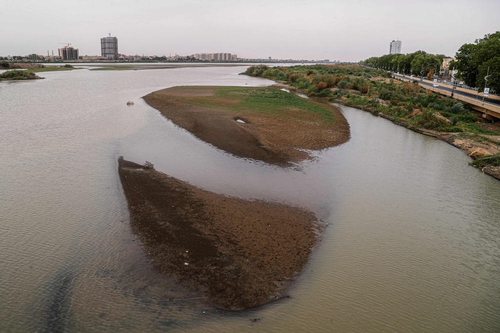 Exposed Blue Nile riverbed in Khartoum on July 27, 2026, as El Nino delays rains and drives water levels lower. — AFP pic