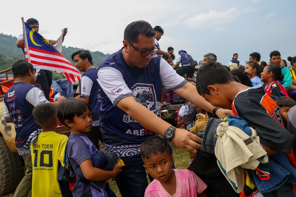 Daily struggles: Kampung Ladoi’s muddy road hampers daily travel, emergency response